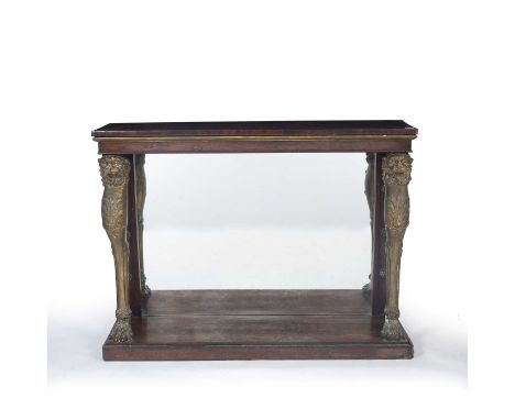 A 19th century rosewood console table with gesso moulded gilt leopard monopodia supports to the front, mirrored back and on a