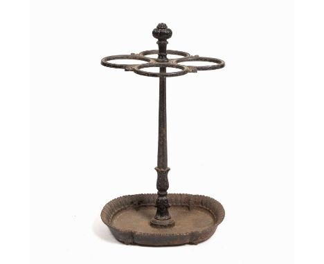 A 19th century cast iron stick stand with central fluted post supporting four oval sections, the base with acanthus leaf deco