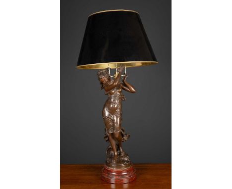 A table lamp constructed from a bronzed French spelter sculpture, on a turned marble plinth base, the maiden 57cm highConditi