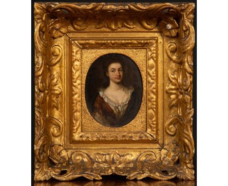 In the manner of Godfrey Kneller half length portrait of a young woman, oils on copper, unsigned, 9cm x 11.3cm (oval)Conditio