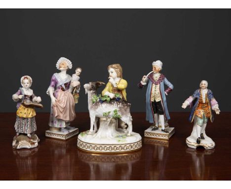 A Meissen porcelain figurine depicting and boy and a goat, 11cm wide together with a Frankerthal figurine of a man smoking a 