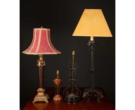 A 20th century painted wrought iron table lamp, 67cm in height; a gilt and glass table lamp of column form, 57cm in height an