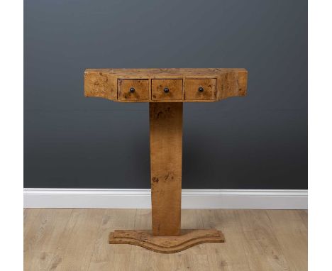 An art deco style marble topped serpentine console table with three drawers and on a plinth base, 81cm wide x 26cm deep x 92c