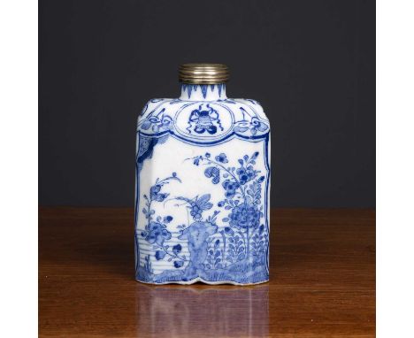 An 18th century Dutch delftware tea canister decorated with a dragonfly perched on a rocky outcrop surrounded by foliage and 