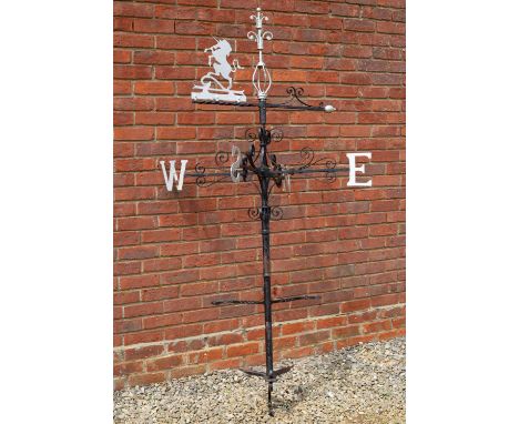 A wrought iron weathervane with unicorn vane, scrolling ornament and bracket for wall mounting, 200cm highCondition report: S