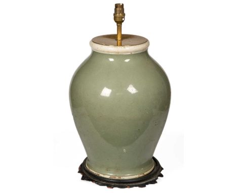 A celadon coloured glazed table lamp of baluster form, 26cm diameter x 46cm highCondition report: The wooden base with damage