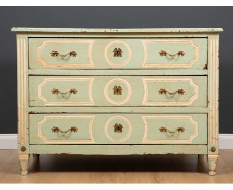 A late 18th / early 19th century Italian green and white painted three drawer commode with moulded ornament to the drawer fro