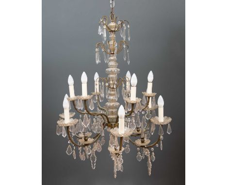 A decorative French style twelve light chandelier with pointed finials to each arm and with cascades of hanging glass drops, 