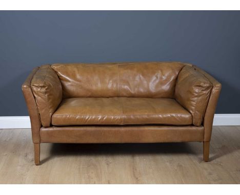 A contemporary tan leather upholstered two seater sofa  on square legs, 149cm wide x 80cm deep x 70cm highCondition report: M