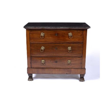 A 19th Century French mahogany and marble topped commode, the three drawers each with lion mask ring handles and all standing