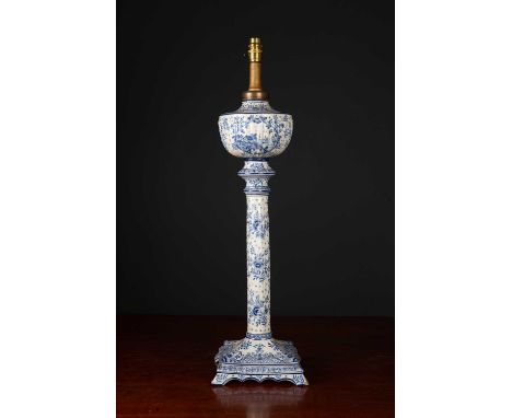 An antique Dutch delftware table lamp with oil reservoir, fluted column and square base, later converted for electric use, 73