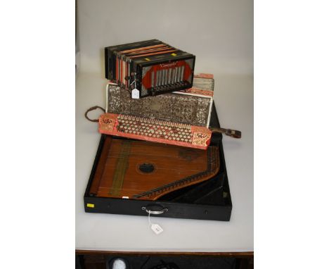 A cased German autoharp with a tuning key, together with an Italian 120 button 95 key accordion by Catania and a German comma