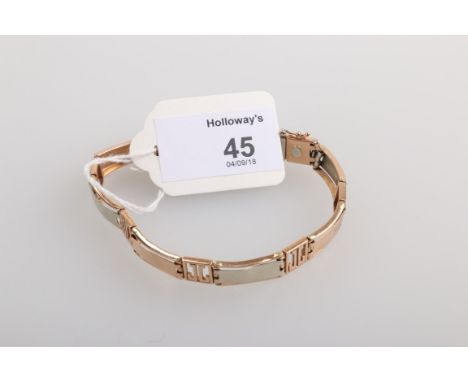 A bi-coloured panel link bracelet, with concealed push button clasp marked '585'