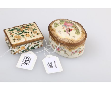 A 19th century porcelain ormolu mounted box of oval form, the hinged cover painted with a courting couple in a landscape, the