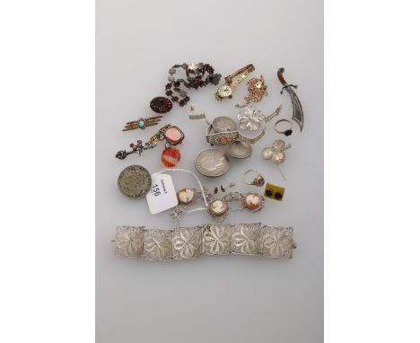 A garnet set suite, comprising necklace, ring, brooch and earrings, composed of floral clusters, a yellow metal bracelet, a s