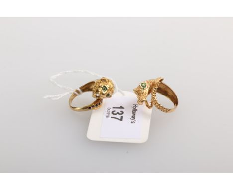 A yellow metal and enamel ring, modelled as a crocodile with open jaws and curled tail, marked '750', and a ceremonial tiger 