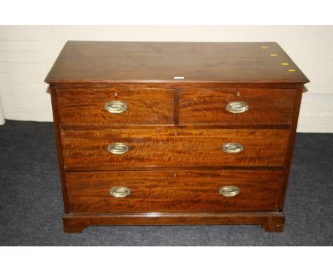 An Edwardian mahogany and strung chest, the rectangular top with moulded edge over two short and two graduated long drawers w