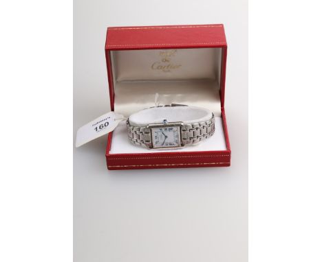 Must de Cartier, a gentleman's silver tank wristwatch, the rectangular enamel dial with Roman numerals and blued steel hands,