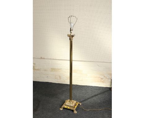 A 20th century brass Corinthian column standard lamp with tasselled silk shade on a stepped plinth and paw feet, 155cm