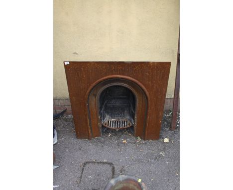 A cast iron horse shoe fire surround and grate, 93 x 93 x 24cm