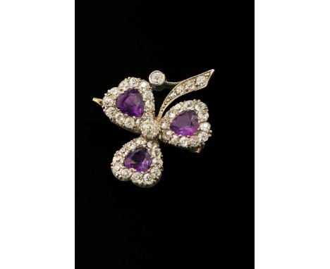 A late Victorian diamond and amethyst clover brooch, the heart-shaped pearls formed as central amethyst within a mixed old cu