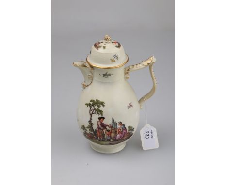 An 18th century Meissen chocolate pot and cover, with gilded pineapple finial to the domed lid, the baluster body with cornuc