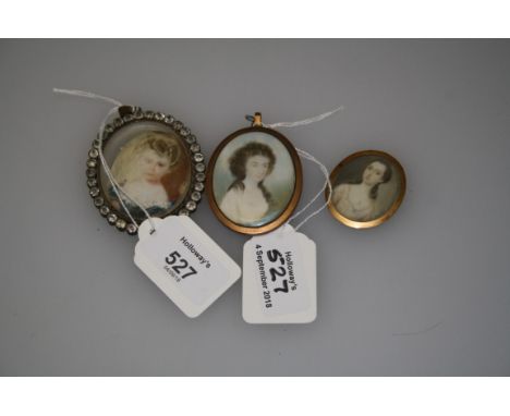 19th century, British School A half length portrait miniature of a young woman with shoulder length dark hair and fair comple