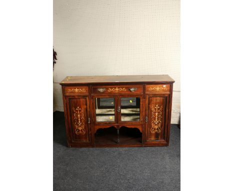 An Edwardian rosewood, inlaid and strung, low dresser, the rectangular top over a single frieze drawer and a pair of glazed d