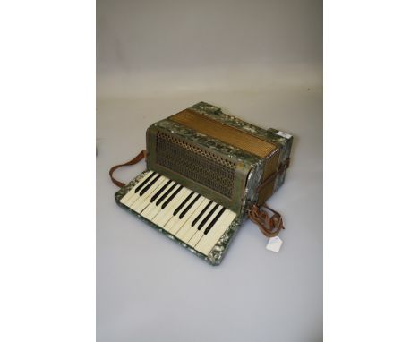 A mid 20th century, probably Italian fifteen key, twelve button accordion, green marbled case