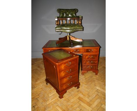 A reproduction mahogany twin pedestal writing desk set with gilt tooled green hide scriber, together with a conforming two dr