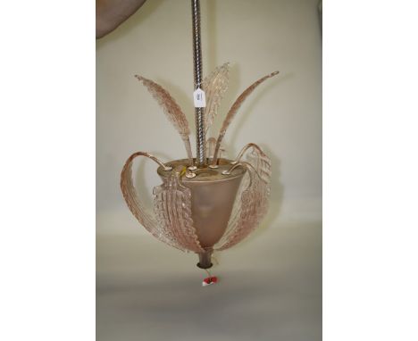 A mid 20th century Venetian pink glass ceiling light with wrythen shaft over an inverted three light bell bowl with pressed f