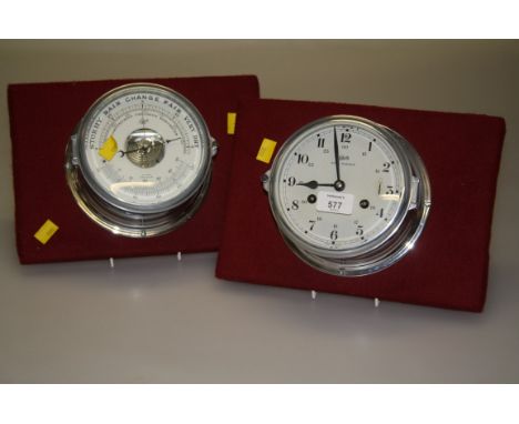 A Makeling barometer/thermometer, with chrome body, 17cm diameter and a similar bulk head clock (2)
