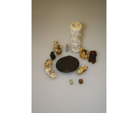 A collection of five 20th century tagua nut netsuke, a brass six sided portrait seal, a spinach jade penguin and other items