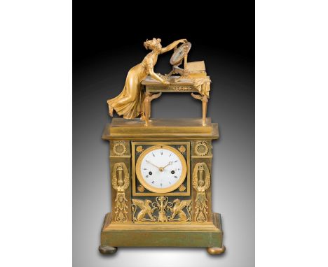 In the manner of Jean André Reiche (1752-1817), a French Empire ormolu mantel clock, the surmount a classical lady at her dre