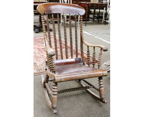 A Late 19th Century Rocking Chair, on bobbin turned support