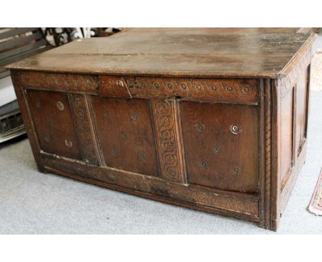 A 17th-century Carved Oak Three Panel Coffer, with hinged lid, 135cm by 57cm by 61cm