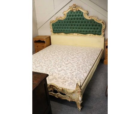 A Rococco Style Cream Painted Double Bed, the headboard with green deep button upholstery, 213cm by 180cm by 160cm