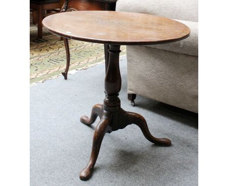 An 18th Century Oak Tripod Table, 74cm by 69cmRepair at opposing sides on the top, some scuffs and scratches here also. The s