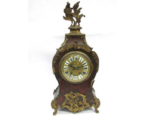 A 19th Century French ebonised and boulle work bracket clock of waisted form, gilded dial with porcelain Roman cartouche chap