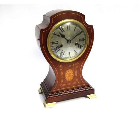 An Edwardian mahogany and inlaid balloon form mantel clock of shaped form, Roman silvered convex dial. 8 day countwheel strik