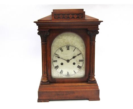 A late Victorian walnut bracket clock of architectural form, Roman silvered dial with HAC (Hamburg American Clock Co.) 8 day 