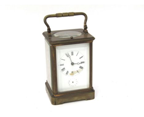 A late 19th/early 20th Century French brass carriage clock, enamelled dial a/f, striking and repeating on a coiled gong. 8 da