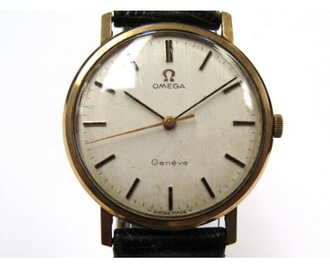 OMEGA: A Genève 9ct gold cased gent's manual wind wristwatch, silvered dial with centre seconds, Omega crown, case diameter 3