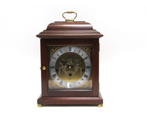 A Comitti of London basket top mantel clock in mahogany case. Manufactured 1980's with A Franz Hermle 340 Westminster chime m