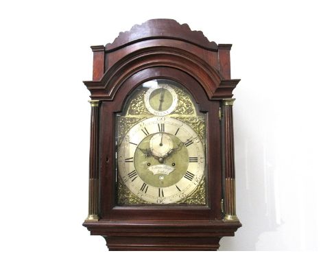 An 18th Century flame mahogany longcase clock, 12" brass arched dial with date wheel, strike/silent dial and subsidiary secon