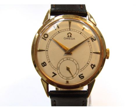 OMEGA: an 18ct gold cased gent's manual wind wristwatch, silvered dial with gilt Arabic numerals and dagger markers with subs
