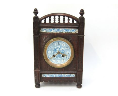 A late 19th Century oak cased mantel clock of architectural form, porcelain Arabic dial. 8 day French drum movement by Japy F