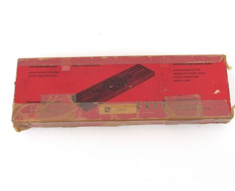 A boxed JAXA universal watch case opening tool