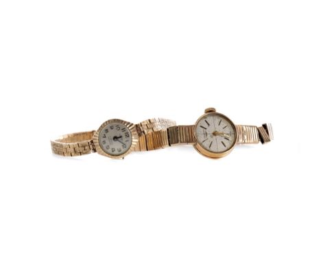LADY'S LONGINES NINE CARAT GOLD MANUAL WIND WRIST WATCH, the round cream dial with applied gold coloured baton hour markers, 