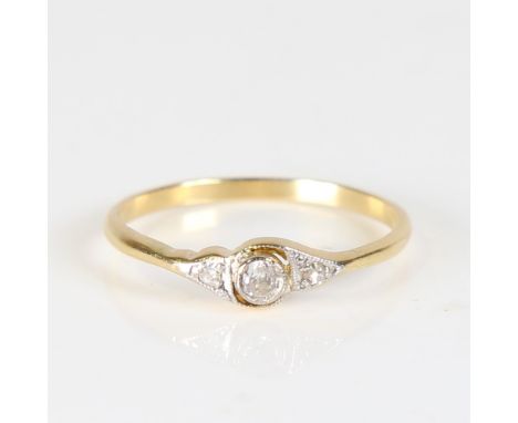 An unmarked gold 3-stone diamond dress ring, set with modern round brilliant and eight cut diamonds, total diamond content 0.